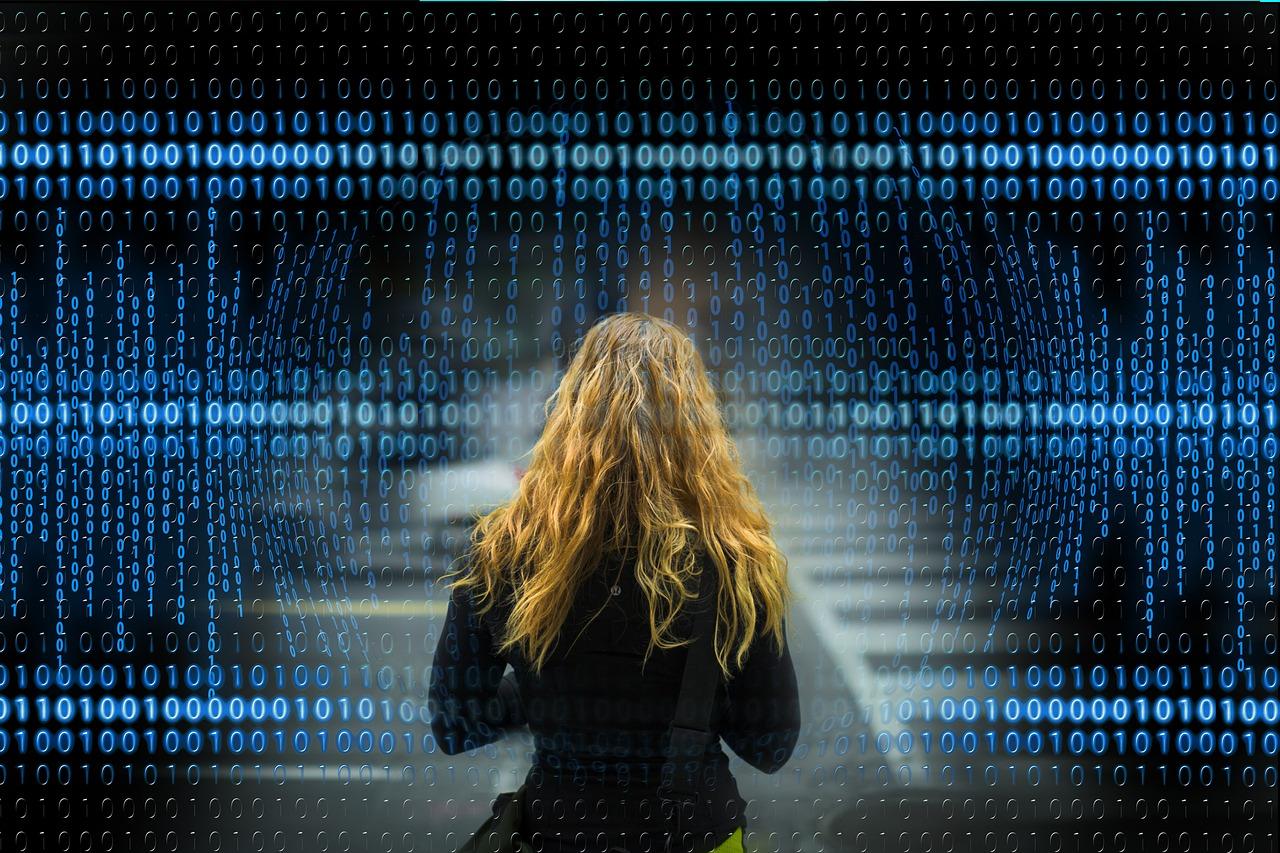 Representación artística de una persona rodeada de código binario, simbolizando la creación de perfiles digitales y la recopilación de datos por parte de las aplicaciones.