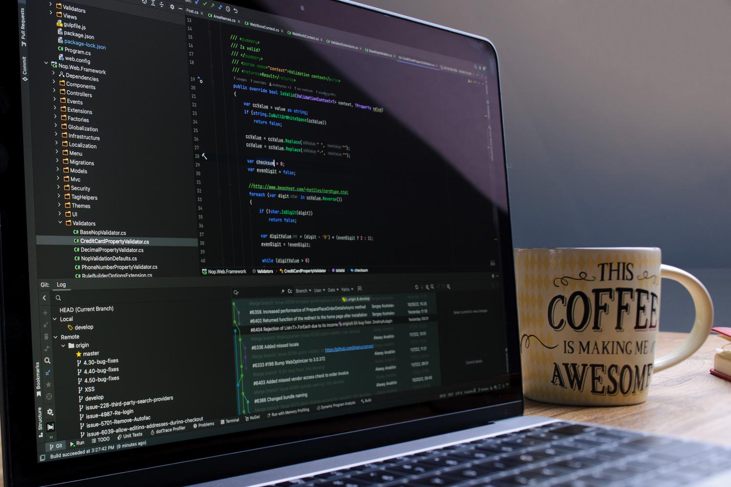 A professional developer's workspace with a laptop running a C# project in an IDE, representing a Windows-based environment suitable for Docker and WSL.