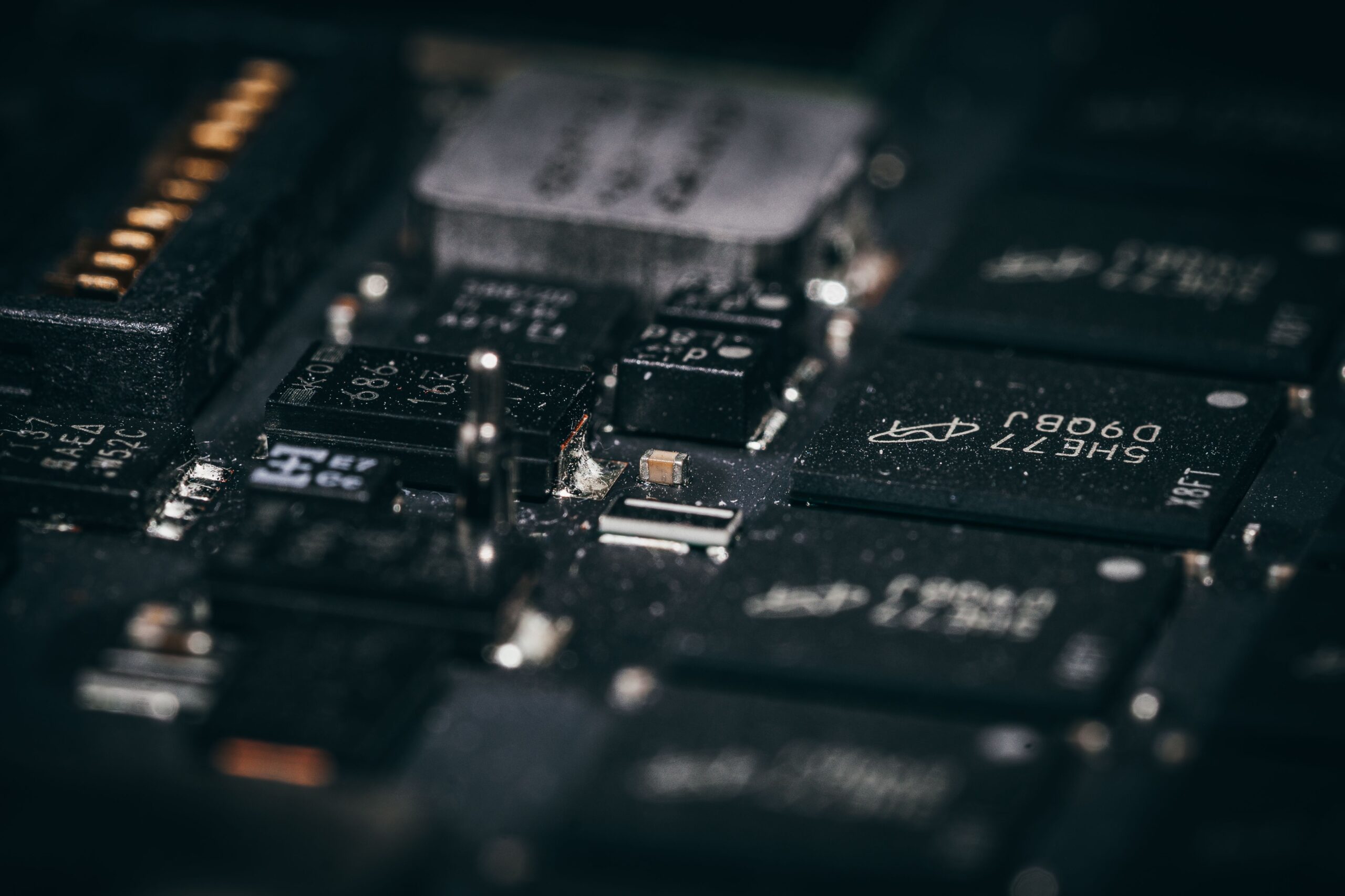 Macro shot of a Micron memory module and high-density surface-mount components on a PCB.